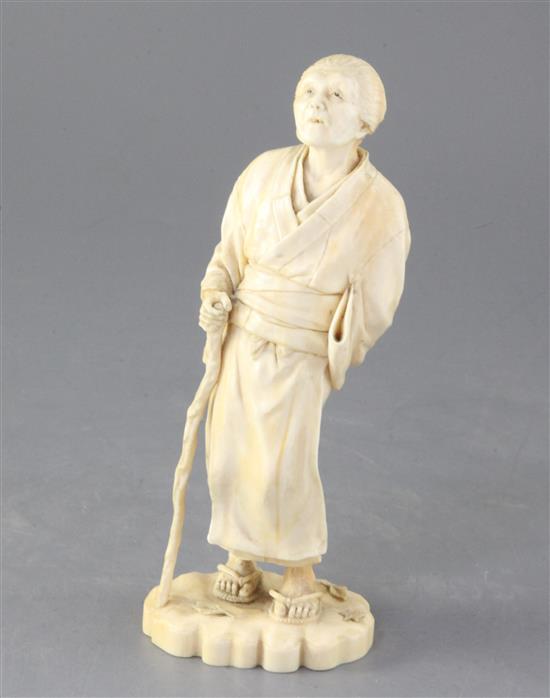 A Japanese ivory figure of an old lady, Tokyo School, Meiji period, height 18.5cm